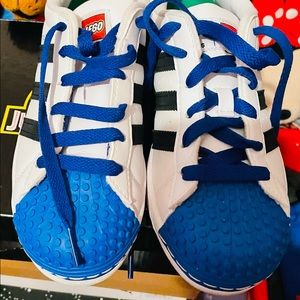 Blue, White, Black Lego Adidas superstars.